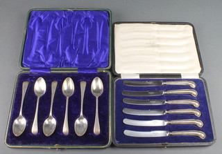 A cased set of 6 silver teaspoons Sheffield 1914 together with 6 silver handled butter knives  
