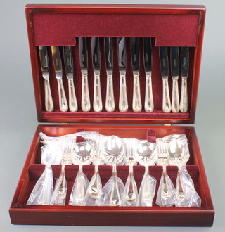 A Newbridge canteen of silver plated cutlery for 6 contained in a mahogany finished canteen
