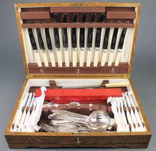 An oak canteen containing a set of silver plated cutlery for 6 