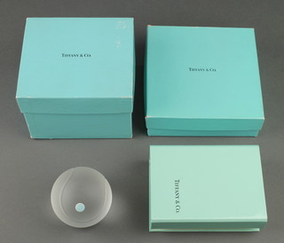 A Tiffany & Co frosted glass spherical paperweight 2 1/2" and a Tiffany & Co set of notelets boxed 