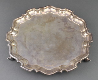 A silver salver with Chippendale rim on scroll feet Sheffield 1961, 410 grams, 10" 