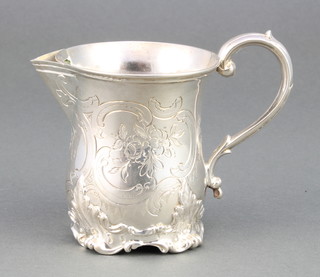 A Victorian silver cream jug with chased floral and scroll decoration with monogram London 1849, 118 grams