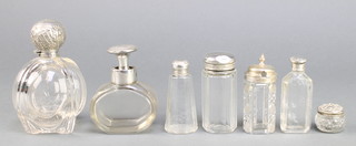 A Victorian silver topped glass scent bottle Birmingham 1899 4 1/2" and 6 other lidded bottles