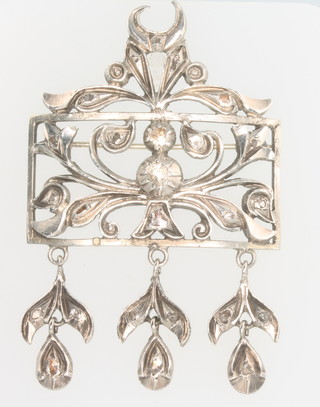 A Russian silver diamond set scroll floral brooch 