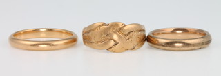 A yellow gold wedding band size R, an 18ct yellow gold signet ring size Q 1/2 and a gilt ring, 10 grams