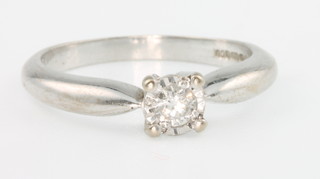 An 18ct white gold single stone diamond ring approx. 0.15ct, size N 1/2