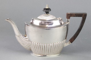 A gentleman's Victorian silver bachelor teapot with demi-fluted decoration and ebony mounts Birmingham 1893, 238 grams gross