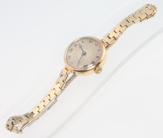 A lady's 18ct yellow gold Rolex wristwatch with red 12 on a gilt bracelet