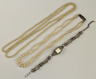 A lady's marcasite wristwatch, a cultured pearl and an imitation pearl necklace