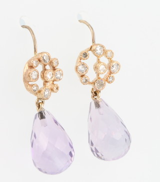A pair of yellow gold earrings with pear cat faceted drop amethysts and brilliant cut diamonds 