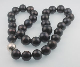 A string of black cultured pearls with silver magnetic clasp 