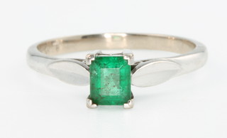 An 18ct white gold baguette cut emerald ring approx. 0.3ct, size P 1/2