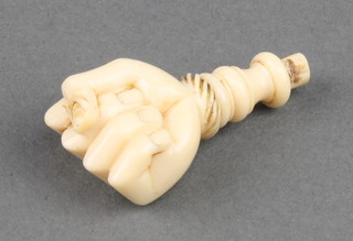 A carved ivory handle in the form of a fist 1 1/2" 