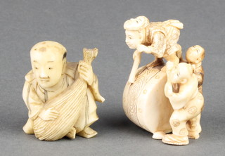 A Japanese ivory Netsuke in the form of 3 men with a giant drum, signed 1 3/4", an Okimono of a man holding a sack 1 1/2" 