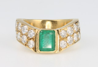 A 14ct yellow gold emerald and diamond up finger ring, size M 