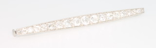 A platinum and diamond set bar brooch approx. 1.5ct 