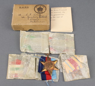 A World War II group of medals to C A Crisp comprising Africa 1939-45 and Italy Stars, Defence and War medal contained in a posting box  