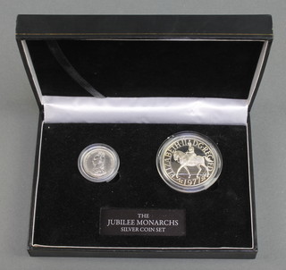 The Jubilee Monarchs silver coin set comprising silver crown 1977 and a shilling 1887, 28 grams, cased