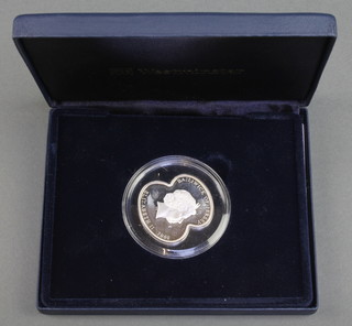 A Royal British Legion silver poppy coin, 28 grams, cased