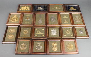 A Victorian Household Cavalry gilt metal Pouch Badge framed and mounted together with 19 other badges