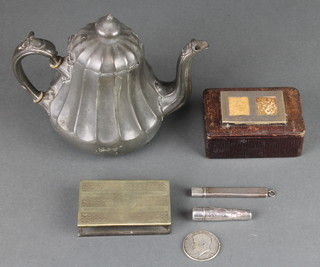 A silver mounted leather stamp box, a JFK half dollar, a silver cigarette holder, do. pencil holder, a vesta case and a Sheffield metal teapot 