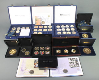 A collection of gold plated Royal Commemorative crowns and medallions