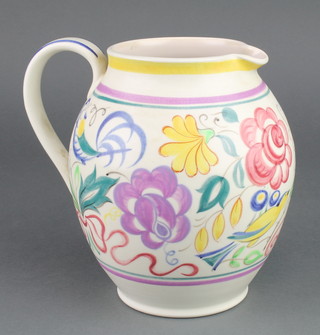 A Poole jug decorated with stylised birds and flowers 7" 