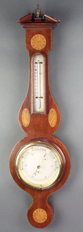 An Edwardian aneroid barometer and thermometer with silvered dial contained in an inlaid wheel mahogany case 