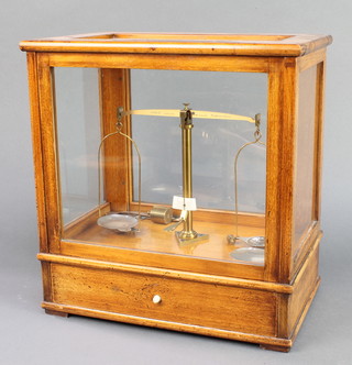 A pair of Class B Oertling laboratory scales contained in a mahogany case