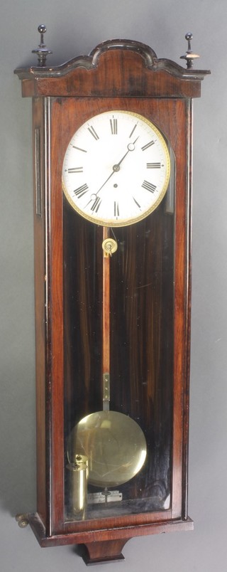 A 19th Century German regulator with 8" enamelled dial and Roman numerals contained in a mahogany case, the pendulum marker marked Berlin.