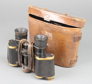 A pair of Voigtlander Braunschweig 6 x 25 field glasses no.15111 contained in a leather carrying case 