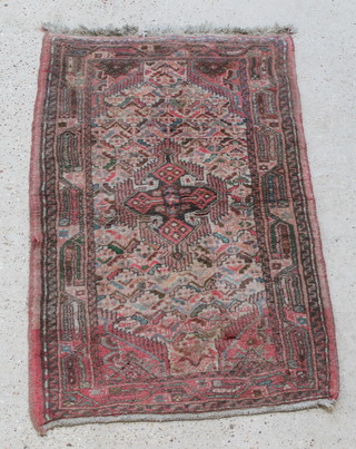 A pink ground Persian rug 49" x 31"