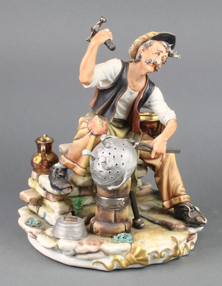 A Capodimonte figure of a metal worker 9" 
