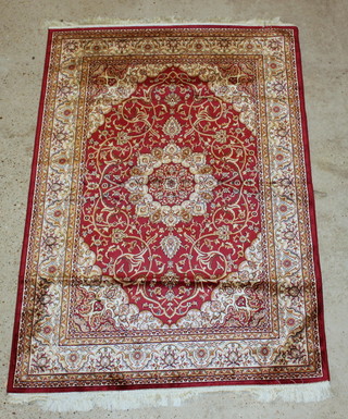 A red ground Persian style Belgian cotton rug with central medallion 75" x 52" 
