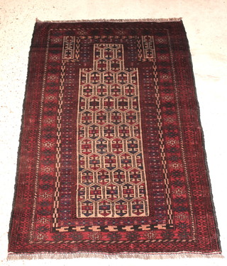 A Baluchi red and blue ground prayer rug with stylised diamonds to the centre 51" x 36" 
