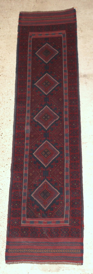 A Meshwani red and blue ground runner with 6 diamonds to the centre 103" x 25" 