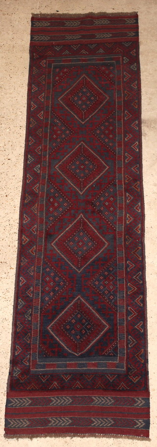 A Meshwani red and blue ground runner with 4 octagons to the centre 100" x 26" 