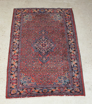 A Persian Bidjar red and blue ground rug with central medallion 79" x 52" 