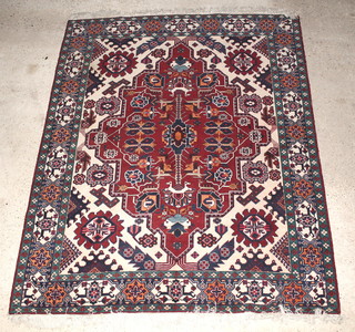 A Tabriz brown and white ground carpet with stylised medallion to the centre and animal motif  114" x 92" 