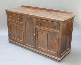An 18th Century style oak dresser base, the top formed from 3 planks fitted 2 drawers above a cupboard with H framed hinges, raised on squared feet 35"h x 60 1/2"w x 22"d 