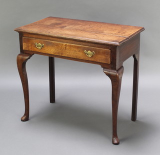 An 18th Century rectangular oak side table fitted a drawer with brass swan neck drop handles, raised on cabriole supports 27"h x 30"w x 17"d 