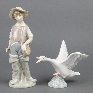 A Lladro figure of a boy fisherman, ditto figure of a goose 5" and a Lladro figure of an Angel violinist (bow missing)  4536 6 1/2" 