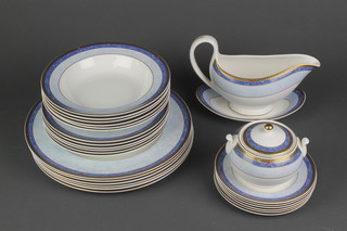 A Wedgwood Valencia pattern part dinner service comprising 6 small plates, 6 medium plates, 6 soup bowls, a sauce boat and stand and a lidded sugar bowl 