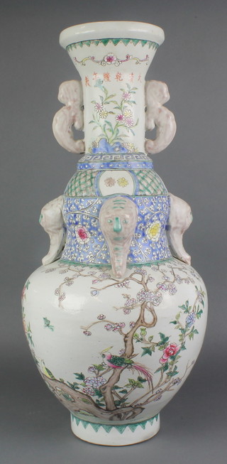 An 18th Century style Chinese famille rose vase and cover with lion handles decorated with birds amongst flowers 24" 