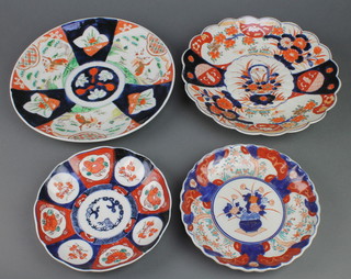 An Imari dish with garden vignette border and enclosed a basket of flowers 8 1/2", a ditto with flowers 8 1/2", 2 larger plates 12" 