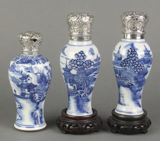 Three 18th Century Chinese blue and white oviform vases decorated with landscape views having european repousse silver covers 5 1/2" 