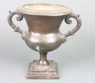 A bronze twin handled urn raised on square base 10"h x 8" diam. 