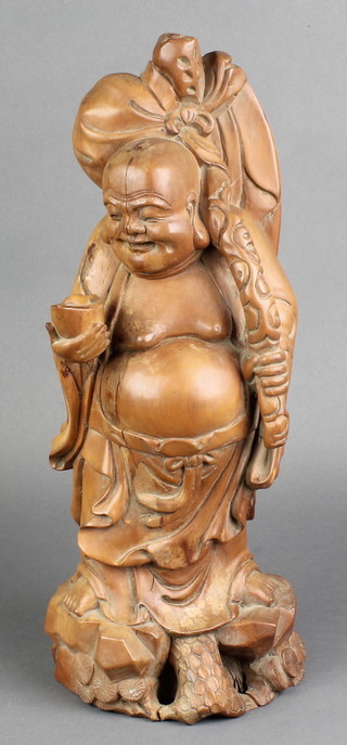 A carved Chinese figure of a standing Buddha 16" 