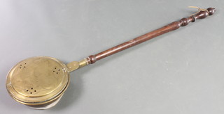 An 18th/19th Century brass warming pan with turned handle 