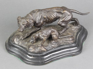 A bronze figure group of dog with puppy, raised on a shaped black marble base 4"h x 9"w x 5"d 